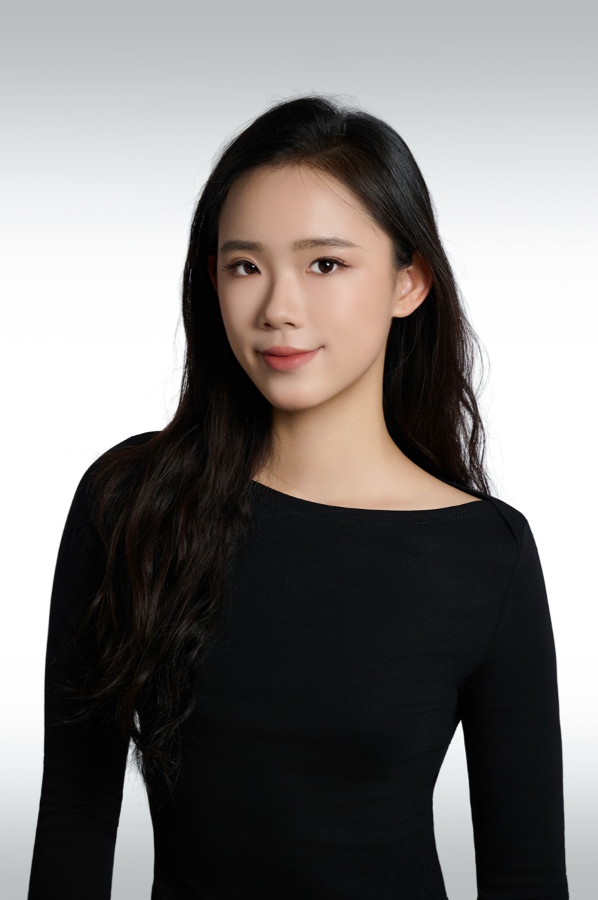 Chenshuo wearing a black top in a studio portrait